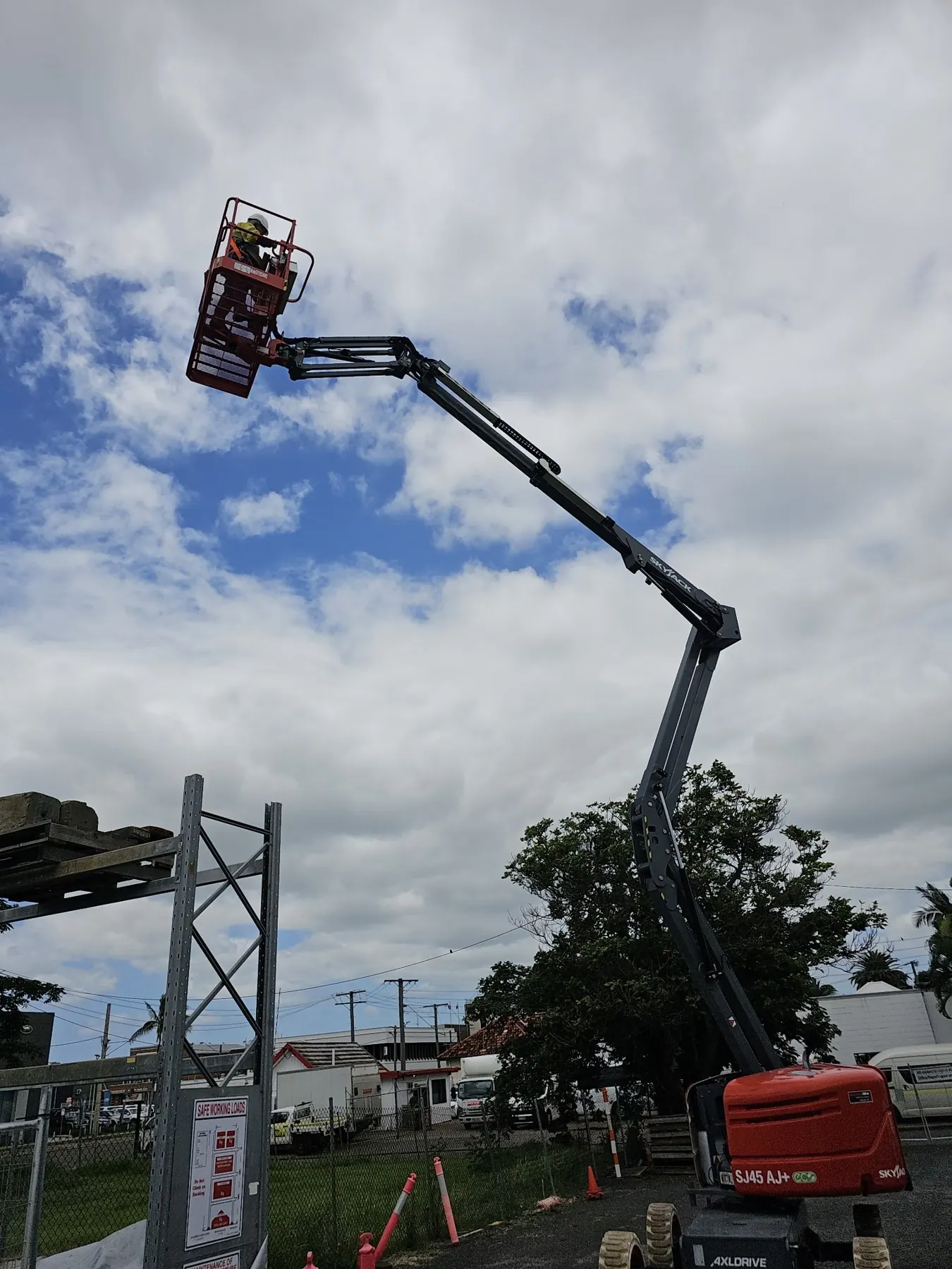 Trainee working from an elevated work platform basket